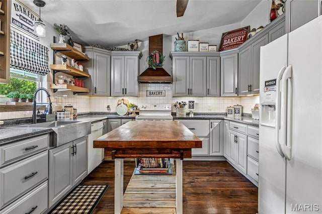 111 Edwards Ln, Park Hills, MO 63601 - kitchen featuring white appliances, wall chimney exhaust hood, gray cabinetry, open shelves, and dark wood-style flooring