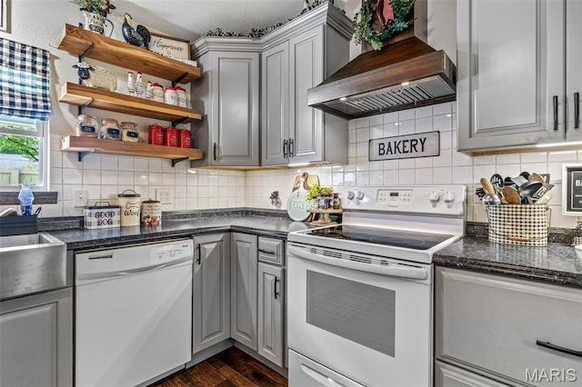 111 Edwards Ln, Park Hills, MO 63601 - kitchen featuring white appliances, wall chimney range hood, gray cabinets, open shelves, and dark wood-style floors