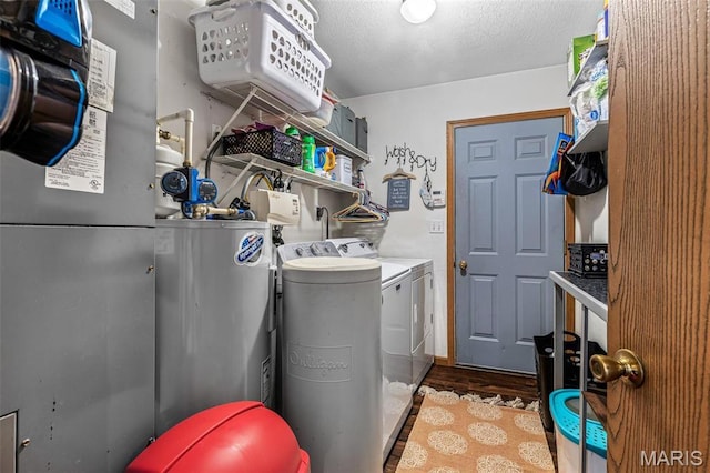 111 Edwards Ln, Park Hills, MO 63601 - washroom with independent washer and dryer, water heater, wood finished floors, and a textured ceiling