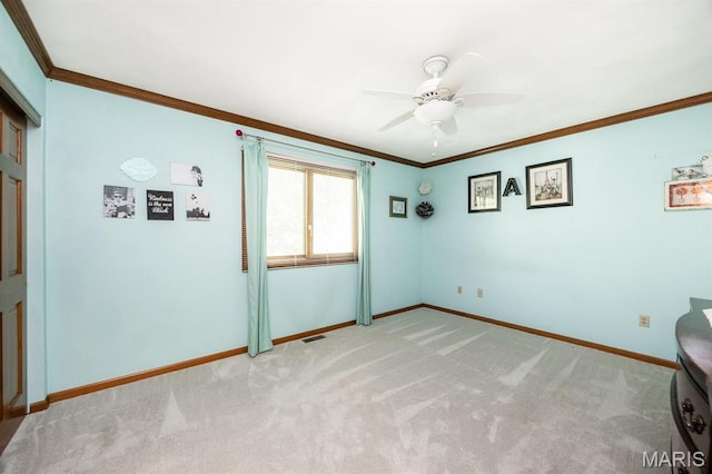 505 Turtle Creek Ct, Ofallon, IL 62269 - spare room with baseboards, a ceiling fan, light carpet, and ornamental molding