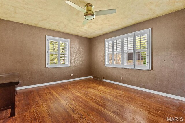 2048 Pontoon Rd, Granite City, IL 62040 - unfurnished room with wood finished floors, ceiling fan, and baseboards