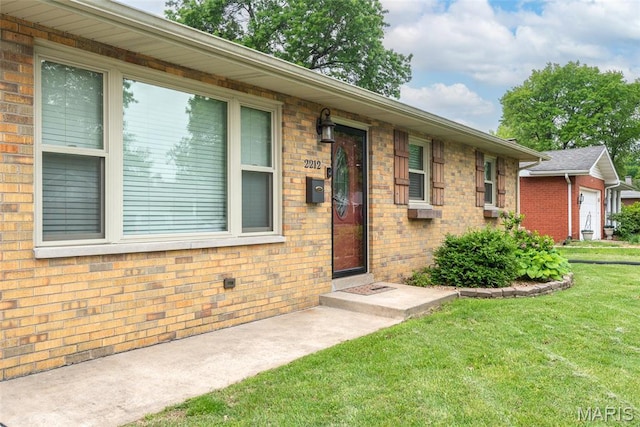 2212 Dawn Pl, Granite City, IL 62040 - entrance to property featuring a lawn and brick siding