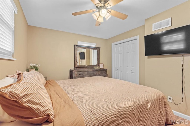 2212 Dawn Pl, Granite City, IL 62040 - bedroom with a closet, baseboards, wood finished floors, and ceiling fan
