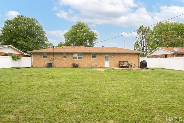 2212 Dawn Pl, Granite City, IL 62040 - back of property with brick siding, central air condition unit, and a patio