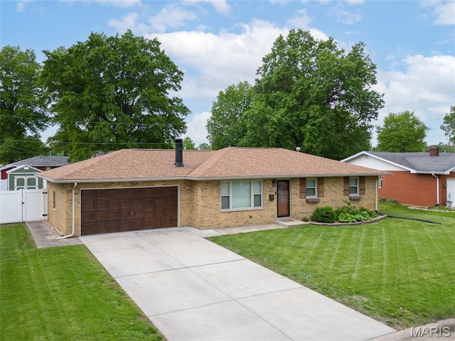 2212 Dawn Pl, Granite City, IL 62040 - single story home featuring an attached garage, a gate, concrete driveway, brick siding, and roof with shingles