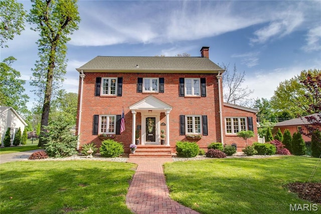 1210 Mckinley Blvd, Alton, IL 62002 - view of front of property with a chimney, a front lawn, and brick siding