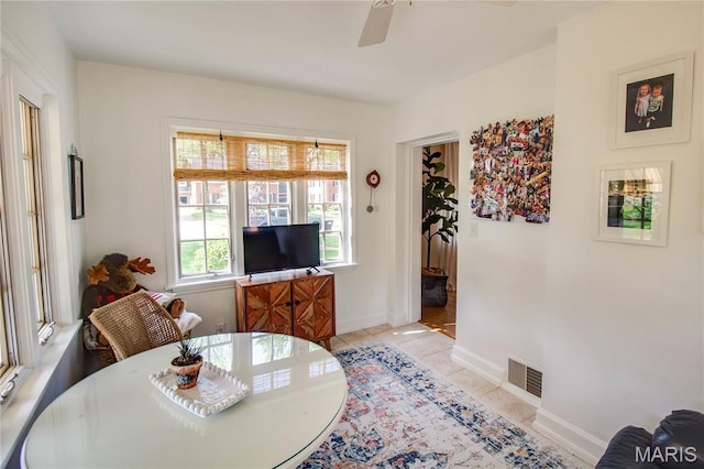 1210 Mckinley Blvd, Alton, IL 62002 - living room with a ceiling fan and light tile patterned floors