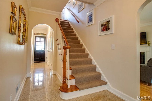 1210 Mckinley Blvd, Alton, IL 62002 - stairs with arched walkways, crown molding, and baseboards