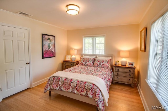1210 Mckinley Blvd, Alton, IL 62002 - bedroom with light wood-style flooring, ornamental molding, and baseboards