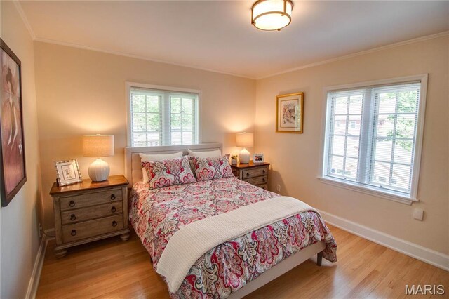 1210 Mckinley Blvd, Alton, IL 62002 - bedroom featuring wood finished floors, multiple windows, baseboards, and crown molding