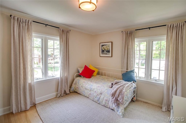 1210 Mckinley Blvd, Alton, IL 62002 - bedroom with multiple windows, baseboards, crown molding, and wood finished floors