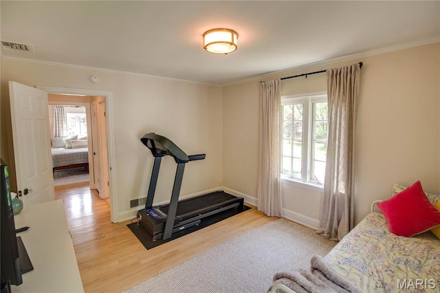 1210 Mckinley Blvd, Alton, IL 62002 - workout area featuring wood finished floors, crown molding, and baseboards