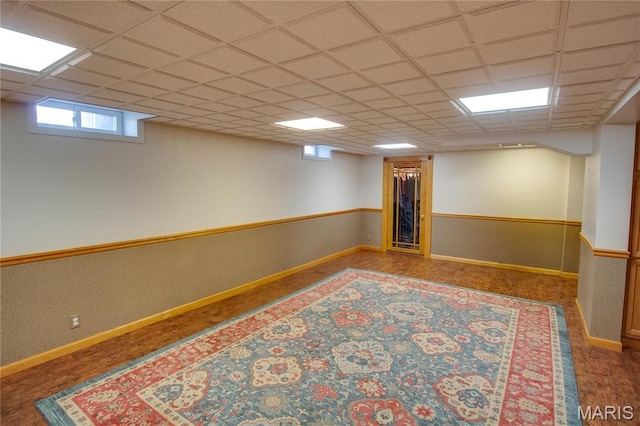 1210 Mckinley Blvd, Alton, IL 62002 - basement with baseboards and a drop ceiling