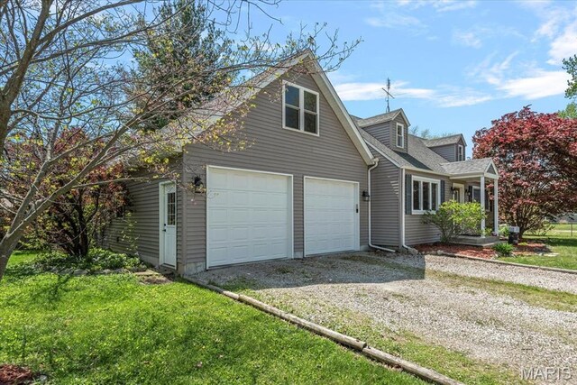 714 W Elm St, Taylorville, IL 62568 - view of front of home with driveway and a front lawn