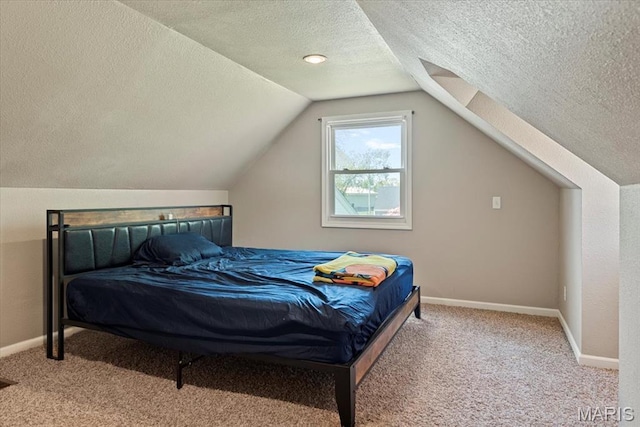 714 W Elm St, Taylorville, IL 62568 - bedroom with a textured ceiling, carpet flooring, baseboards, and lofted ceiling