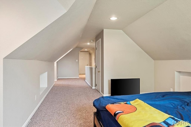 714 W Elm St, Taylorville, IL 62568 - carpeted bedroom with vaulted ceiling, baseboards, and recessed lighting