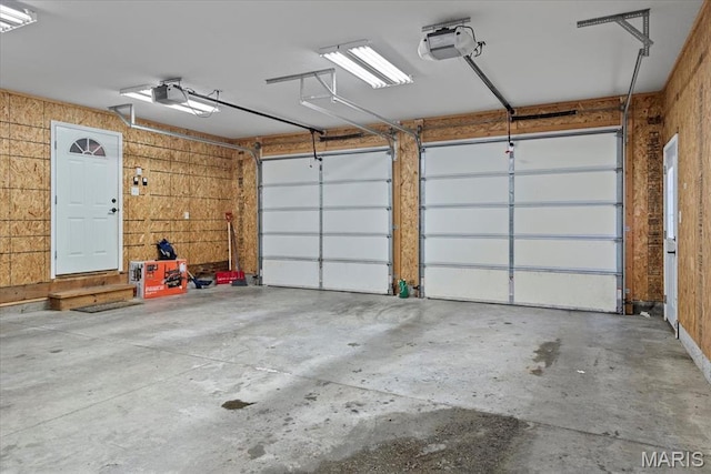 714 W Elm St, Taylorville, IL 62568 - garage featuring a garage door opener