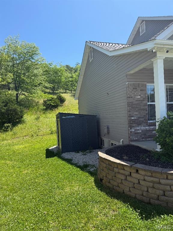 203 Chadwyck Cir, Herculaneum, MO 63048 - view of home's exterior with a yard and brick siding