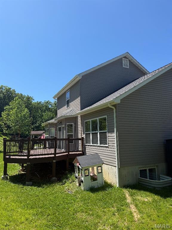 203 Chadwyck Cir, Herculaneum, MO 63048 - back of property featuring a yard and a deck
