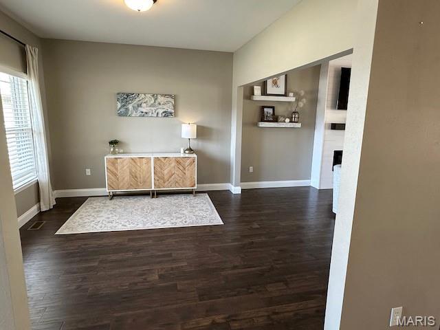 203 Chadwyck Cir, Herculaneum, MO 63048 - home office with healthy amount of natural light, dark wood finished floors, and baseboards