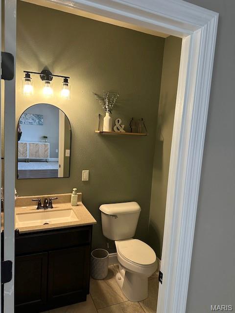 203 Chadwyck Cir, Herculaneum, MO 63048 - bathroom with vanity, toilet, and tile patterned floors