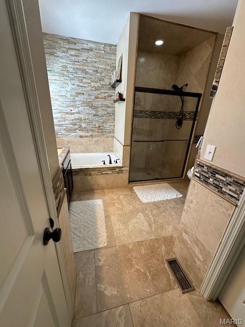 203 Chadwyck Cir, Herculaneum, MO 63048 - full bathroom with a bath, tiled shower, vanity, and stone finish flooring