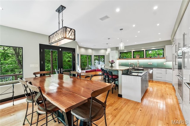 400 Gabriel Dr, Kirkwood, MO 63122 - dining space with plenty of natural light, light wood-type flooring, and recessed lighting