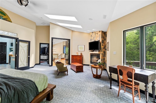 400 Gabriel Dr, Kirkwood, MO 63122 - carpeted bedroom with a skylight, a stone fireplace, and high vaulted ceiling