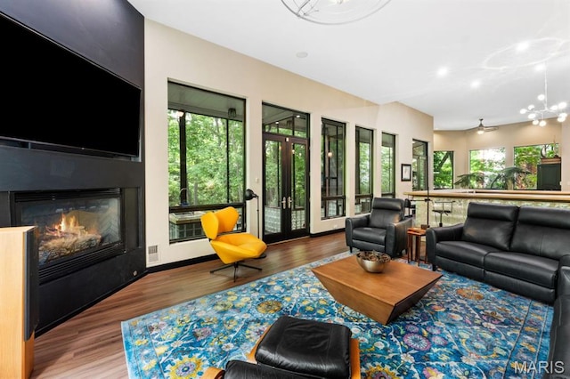 400 Gabriel Dr, Kirkwood, MO 63122 - living room with wood finished floors, a large fireplace, and recessed lighting