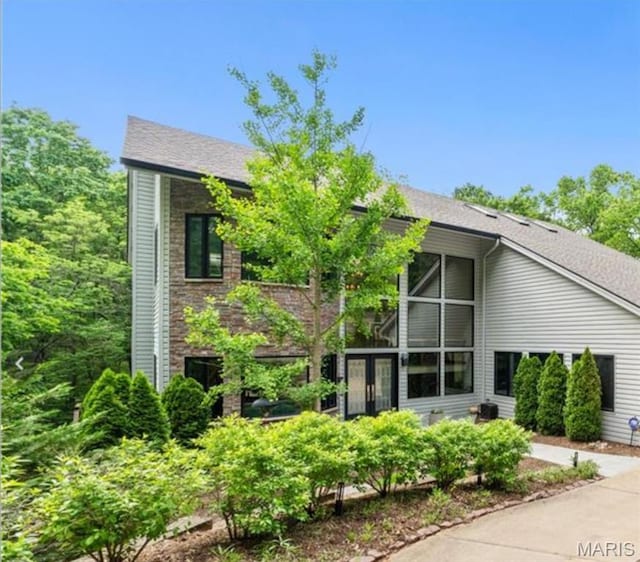 400 Gabriel Dr, Kirkwood, MO 63122 - rear view of house with french doors and a shingled roof