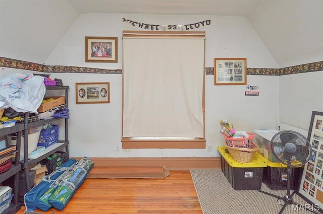 rec room featuring vaulted ceiling and wood finished floors