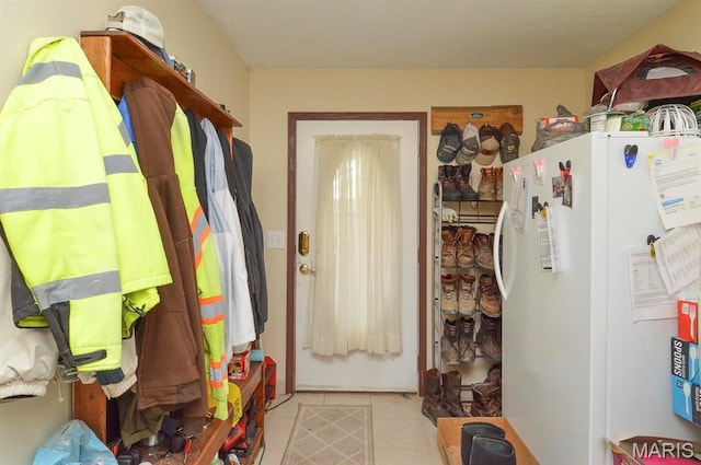 mudroom with tile patterned floors