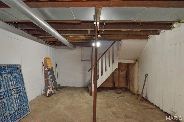 unfinished below grade area featuring stairway