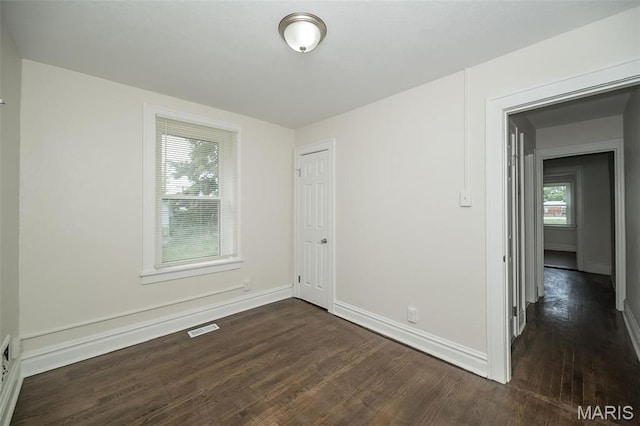 4117 Ravenwood Ave, Saint Louis, MO 63121 - unfurnished room featuring dark wood-style floors and baseboards