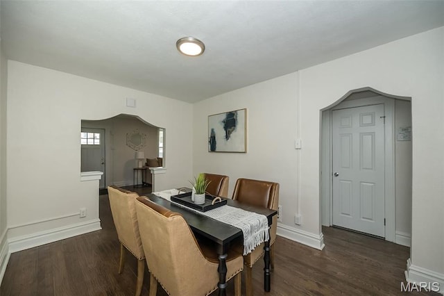 4117 Ravenwood Ave, Saint Louis, MO 63121 - dining room featuring dark wood-style flooring and baseboards