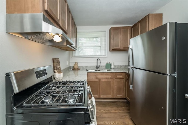 4117 Ravenwood Ave, Saint Louis, MO 63121 - kitchen featuring stainless steel appliances, range hood, a sink, light stone counters, and brown cabinetry