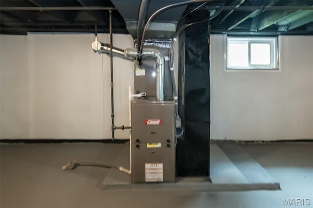 4117 Ravenwood Ave, Saint Louis, MO 63121 - utility room with heating unit