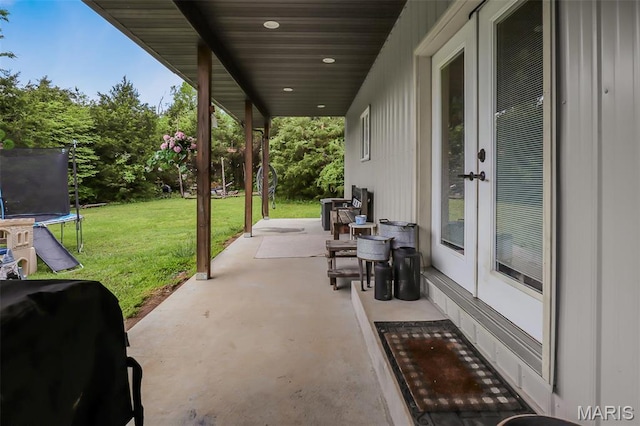 1350 Madison 500, Fredericktown, MO 63645 - view of patio featuring a trampoline, grilling area, and french doors