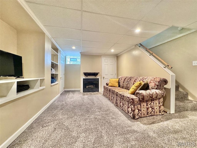living room with carpet, a fireplace, baseboards, recessed lighting, and stairs