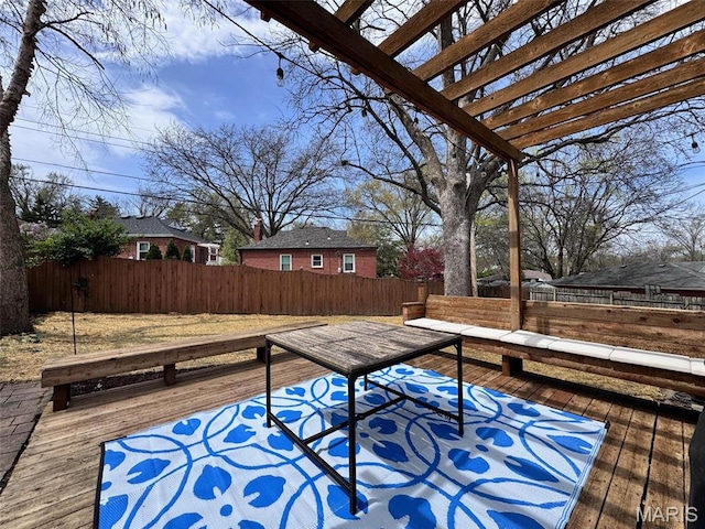 wooden terrace with a fenced backyard and a pergola