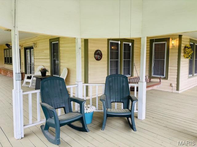 305 Frisco St, Steelville, MO 65565 - wooden deck featuring a porch