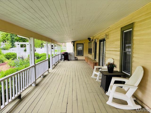 305 Frisco St, Steelville, MO 65565 - wooden deck with a porch