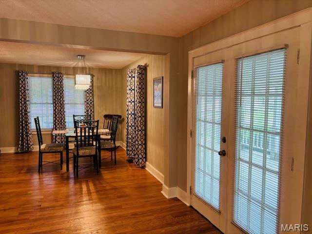305 Frisco St, Steelville, MO 65565 - dining area with baseboards, dark wood-style floors, and french doors