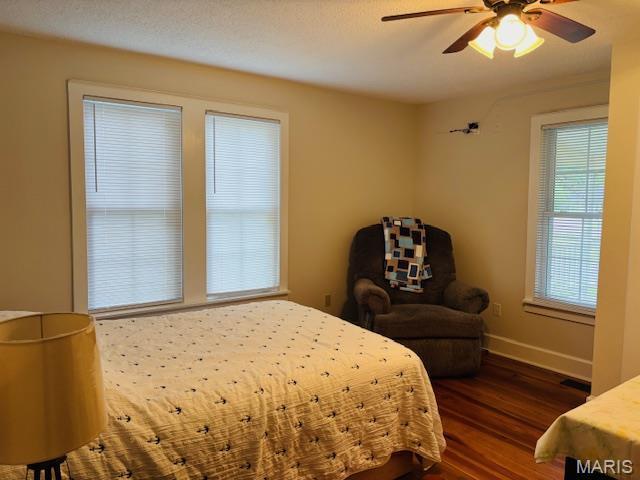 305 Frisco St, Steelville, MO 65565 - bedroom with wood finished floors, baseboards, and a ceiling fan