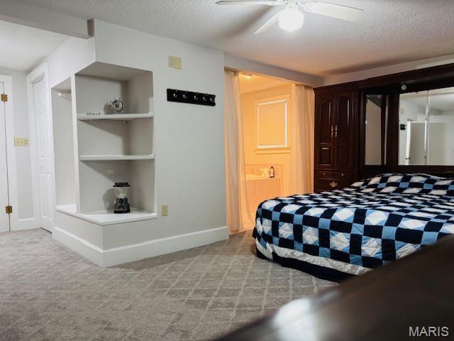 305 Frisco St, Steelville, MO 65565 - carpeted bedroom featuring a textured ceiling, baseboards, and a ceiling fan