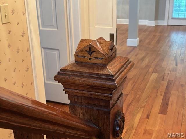 305 Frisco St, Steelville, MO 65565 - stairway featuring wood finished floors, baseboards, and wallpapered walls