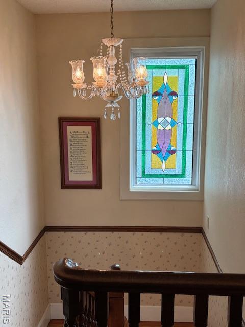 305 Frisco St, Steelville, MO 65565 - staircase with a chandelier and baseboards