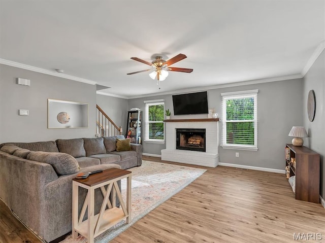 447 Omar Ct, Saint Peters, MO 63376 - living area with plenty of natural light, stairs, crown molding, and light wood-type flooring
