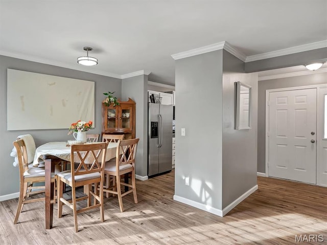 447 Omar Ct, Saint Peters, MO 63376 - dining room with baseboards, light wood-type flooring, and ornamental molding
