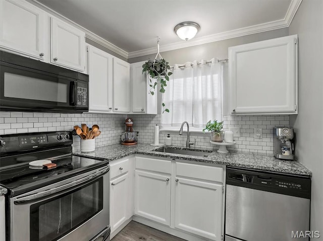 447 Omar Ct, Saint Peters, MO 63376 - kitchen with appliances with stainless steel finishes, a sink, white cabinets, light stone counters, and crown molding